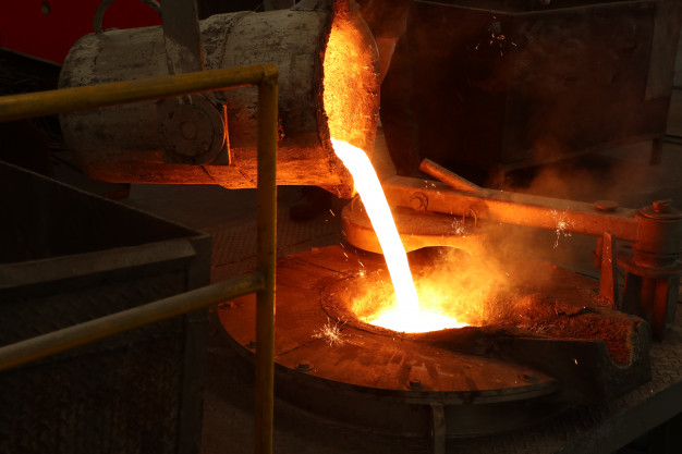 molten-iron-pour-from-ladle-into-melting-furnace_29362-102